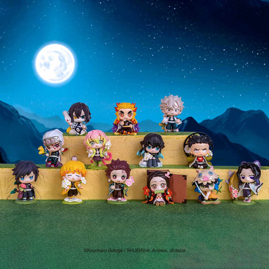 Collection of anime character figurines on a platform with a night sky and moon in the background