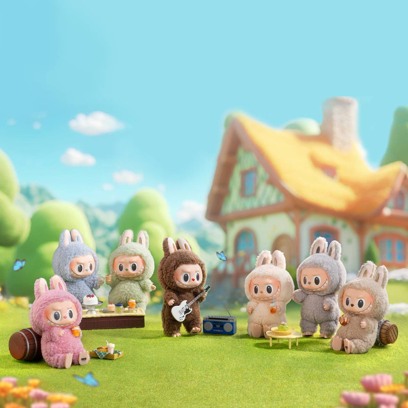 Toy figures of animals in costumes playing instruments in a colorful outdoor setting with a house in the background.