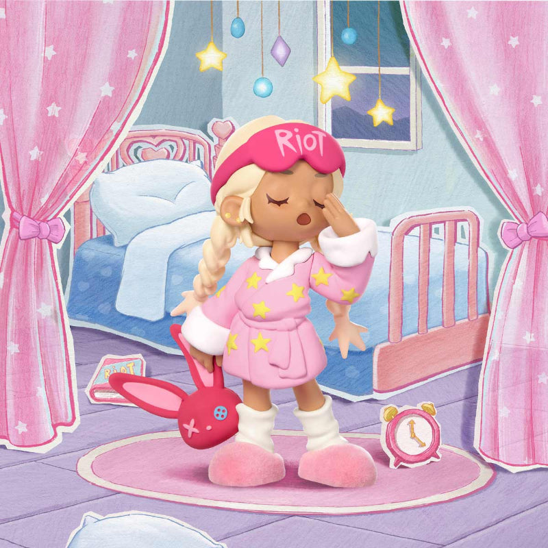 Toy figure in a pink outfit with 'Riot' headband in a bedroom setting
