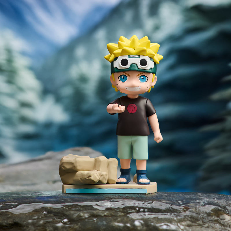 Toy figure of a character with a mountainous background