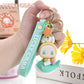 Lucky Emma Baby Keychain, this is one of the many options you can get, displayed by a person holding the keychain