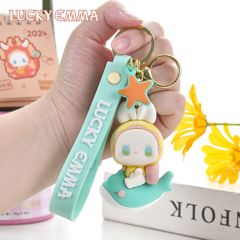 Lucky Emma Baby Keychain, this is one of the many options you can get, displayed by a person holding the keychain