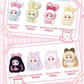Set of cute cartoon character figurines with various flavors labeled on a pink background.