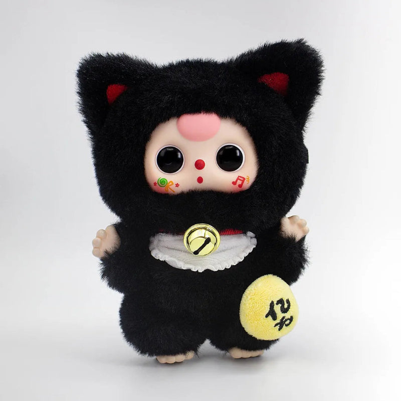 Plush toy with black cat ears and face, wearing a black outfit with yellow accents on a white background