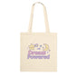 Beige tote bag with 'Dream Powered' text and star and moon graphics on a white background