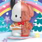 Sanrio Snowy Dreams Blind Box, Pochacco figurine displayed on a wintery cartoon background.