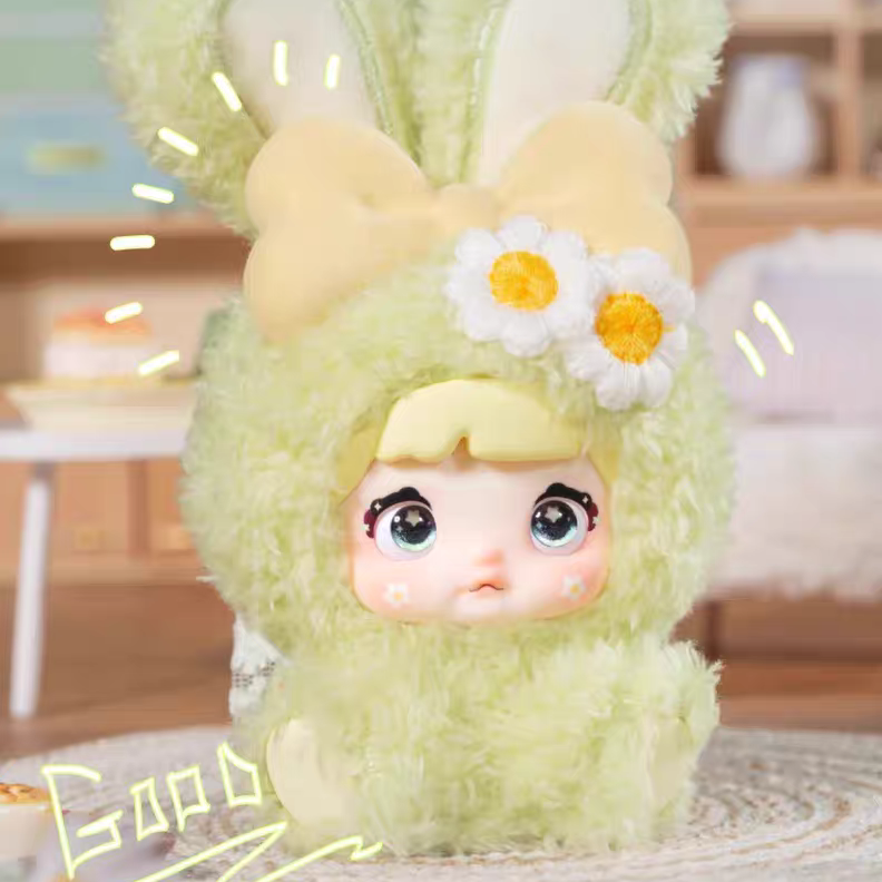 Plush toy in a green bunny costume with a blurred indoor background