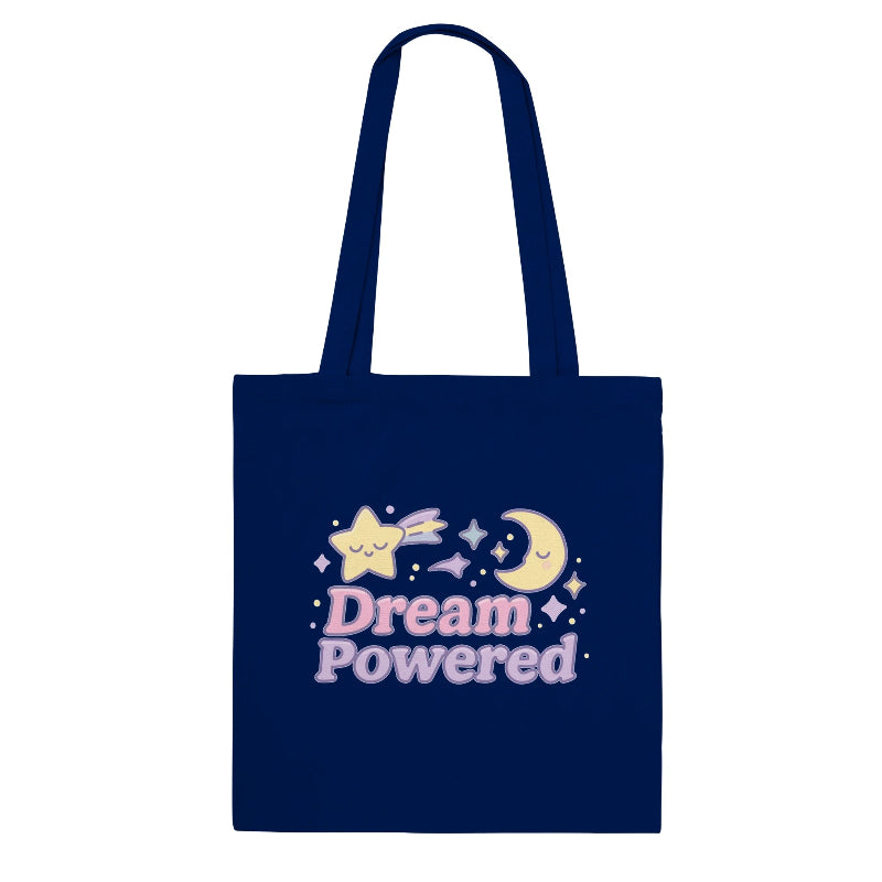 Navy blue tote bag with 'Dream Powered' design featuring a star and moon on a white background