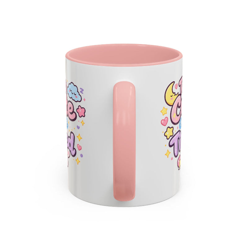 White mug with pink handle and colorful designs on a white background