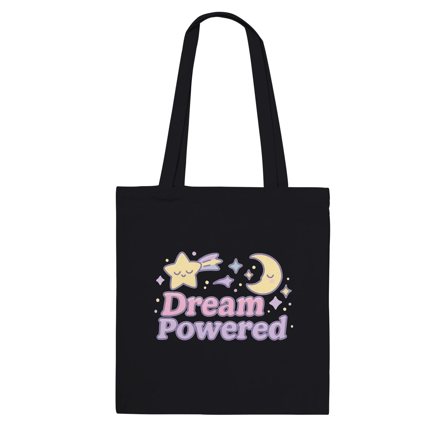 Black tote bag with 'Dream Powered' text and kawaii celestial designs on a white background