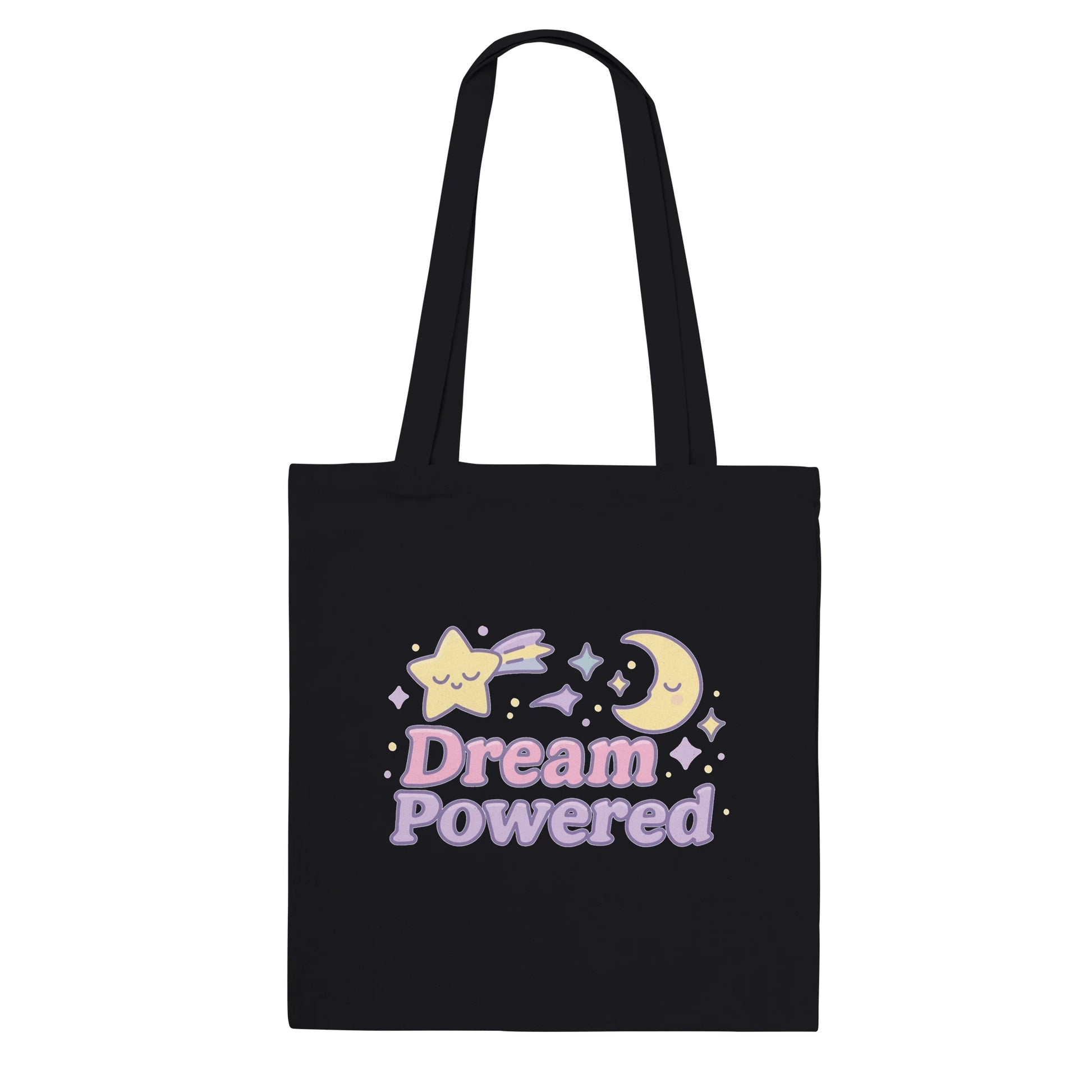 Black tote bag with 'Dream Powered' text and kawaii celestial designs on a white background