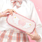 Person holding a pink Nintendo Switch case wagainst a pink background