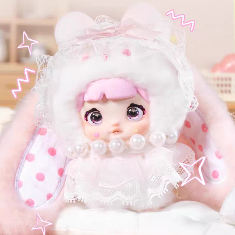kawaii blind box plushie with white outfit and pink accents on a light background