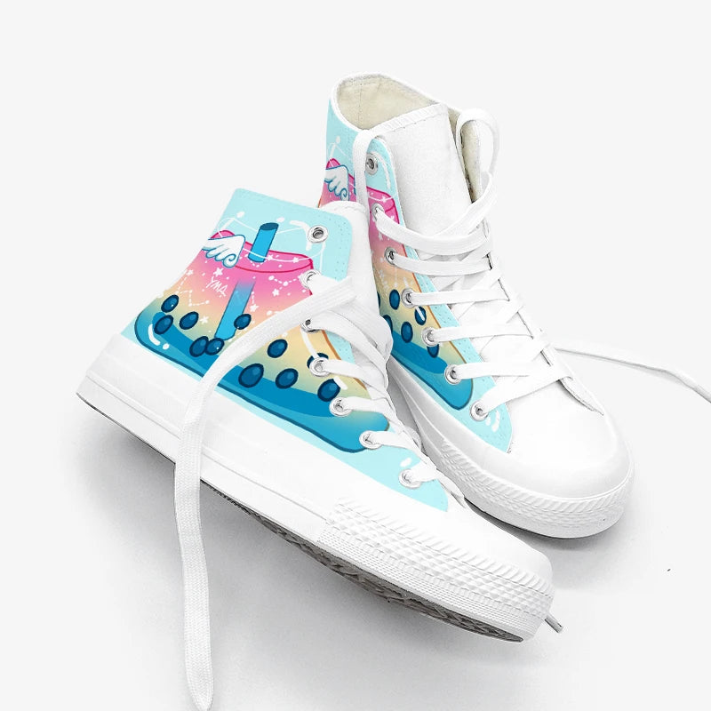 A pair of white high-top canvas sneakers with colorful pastel graphics on the sides and tongue. The graphics feature a pink boba tea cup with blue pearls  on a light blue background.