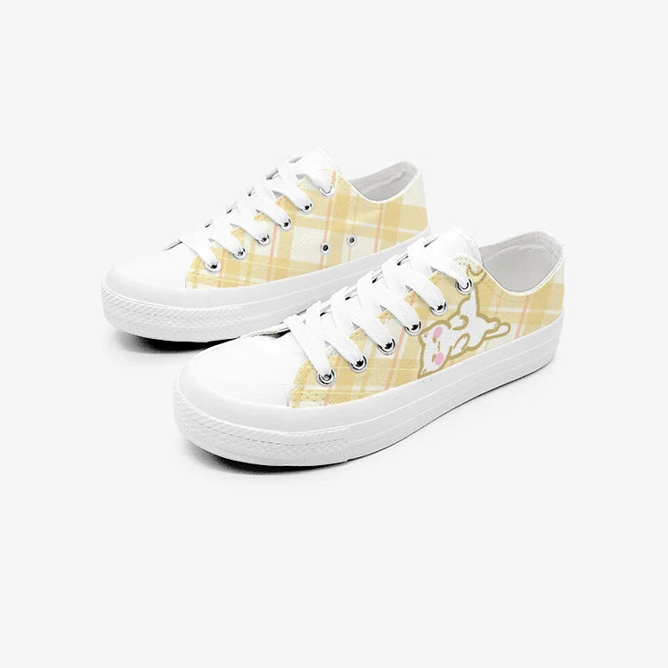 White kawaii sneakers with yellow pattern on a white background