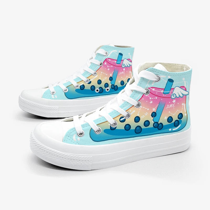 A pair of high-top canvas sneakers with a colorful boba tea illustration on the side panels, featuring white laces and white rubber soles, set against a plain light gray background.