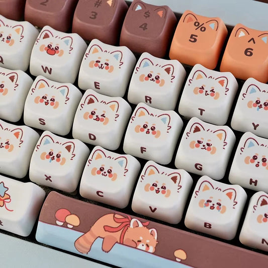 Keyboard keys with red panda designs on a white background