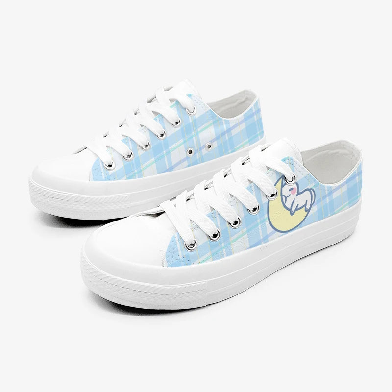 White kawaii sneakers with blue plaid pattern and cat character on a white background