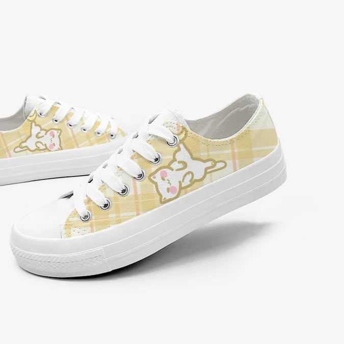 Pair of white kawaii sneakers with yellow plaid  pattern on a white background