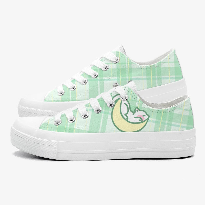 Green plaid kawaii sneakers with a moon and cat design on a white background