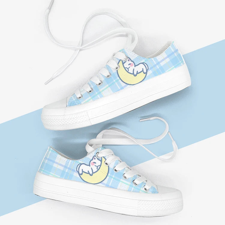 White sneakers with kawaii character design on a white and blue background