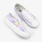 Top side view of white sneakers with purple and pink plaid pattern and Kawaii character on a white background