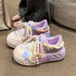 Kawaii Pastel-colored sneakers with decorative Pearl elements on a carpeted floor.