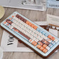 Keyboard with red panda keys on a wooden surface