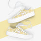 White kawaii cat sneakers with yellow plaid design on a white and yellow striped background