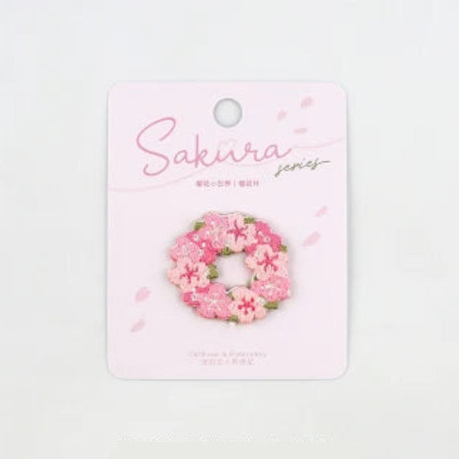 Kawaii Cherry Blossom Iron-On Embroidery Patch , the design displayed is the cherry blossom wreath , the picture is showing the measurements of the patch.