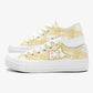 White sneakers with yellow plaid pattern and cartoon cat on a white background