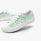 Pair of green sneakers with a kawaii cat  on a white background