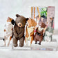 Collection of animal figurines on a clear stand with a white background