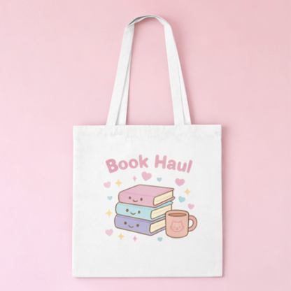 Tote bag with 'Book Haul' design featuring books and a mug on a pink background