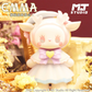 Toy figure with animal-like features on a decorative background with 'MJ Studio' branding.
