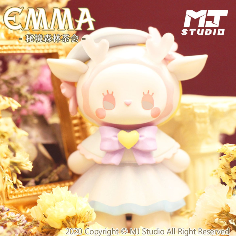 Toy figure with animal-like features on a decorative background with 'MJ Studio' branding.