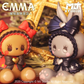 Two cute figurines with bows, one brown and one gray, against a blurred background with 'EMMA' and 'MJ Studio' branding.