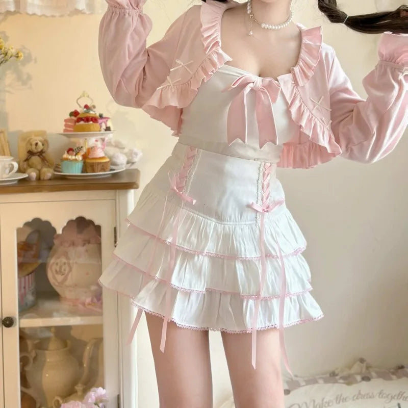 Person wearing a white dress with pink accents in a room with decorative items.