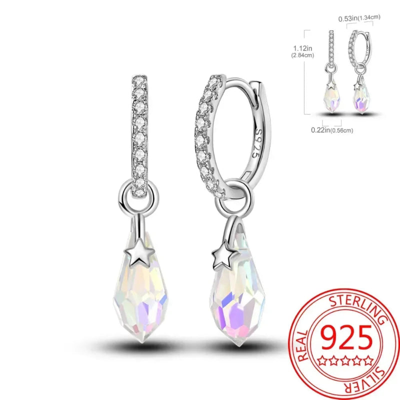 Silver earrings with teardrop-shaped crystals on a white background, featuring a 'Real Sterling 925' stamp.