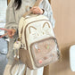 brown neko backpack displayed by person holding them.