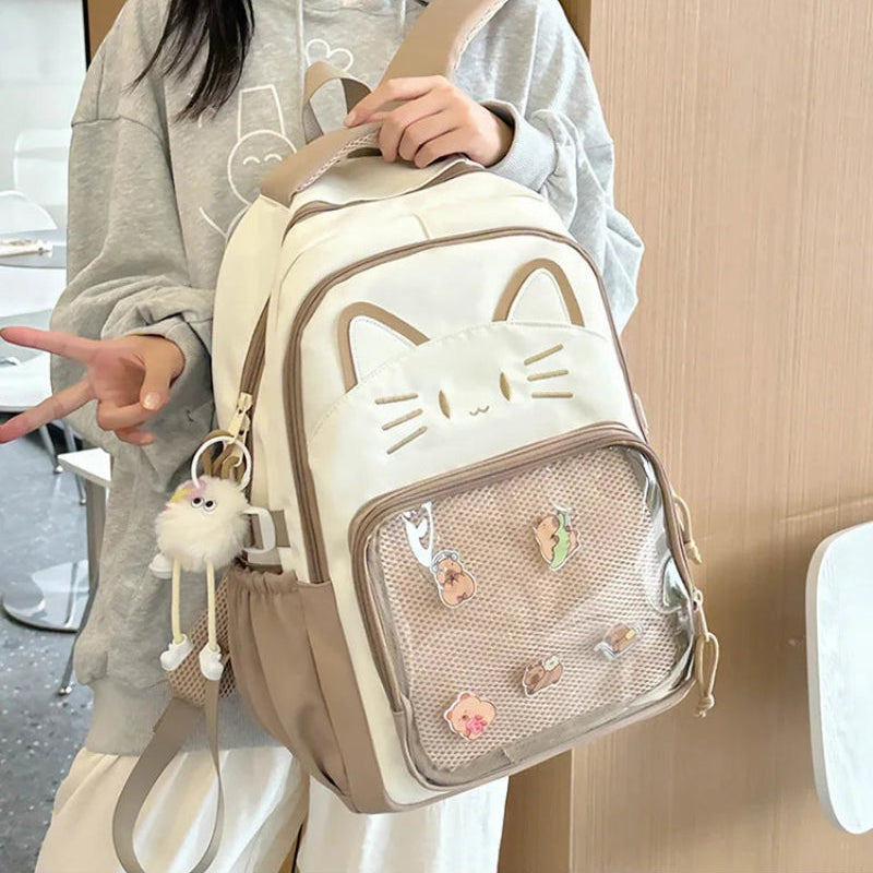brown neko backpack displayed by person holding them.