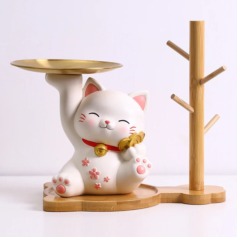 cat-shaped candle holder with a gold bell on a white background