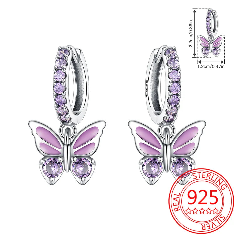 Butterfly earrings with purple accents and a 'Real Sterling 925' stamp on a white background