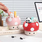 Two mushroom-shaped desk organizers with kawaii animal figures on a desk.