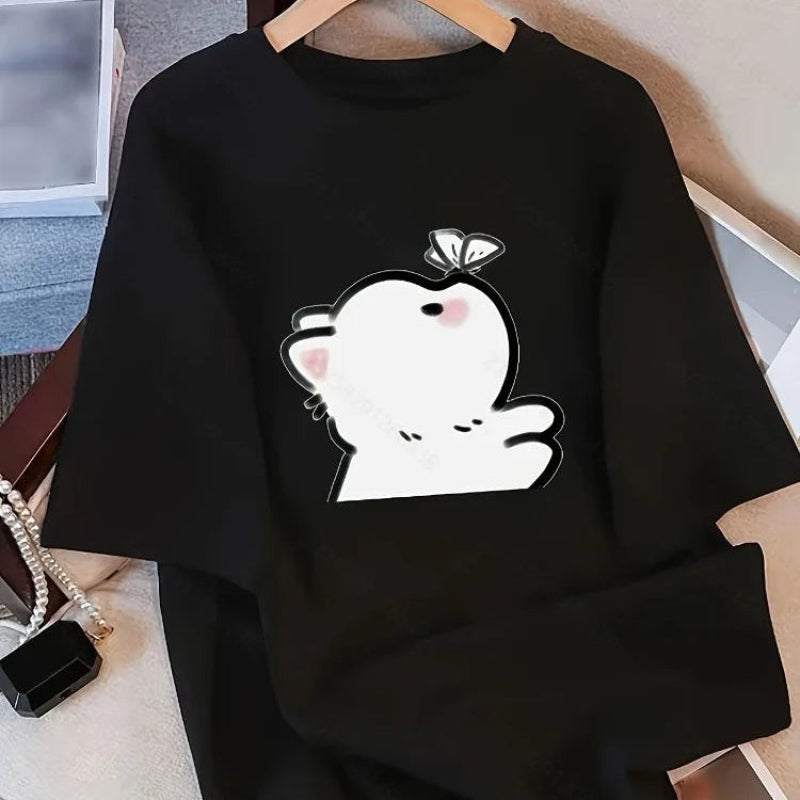 Black shirt with a kawaii white cat, and a small butterfly landing on its nose designed on a hanger. 