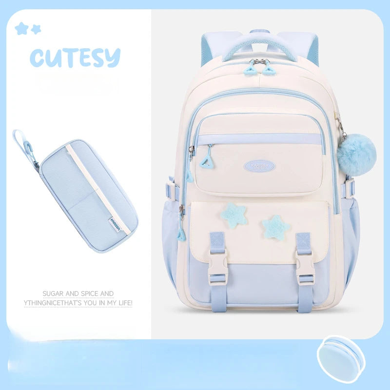 Cutesy white and light blue backpack with matching pouch on a light blue background
