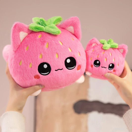 Front view of Kawaii Strawberry Cat Plushies held by a woman