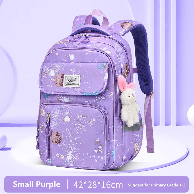Purple backpack with star pattern and bunny plush toy on a light purple background
