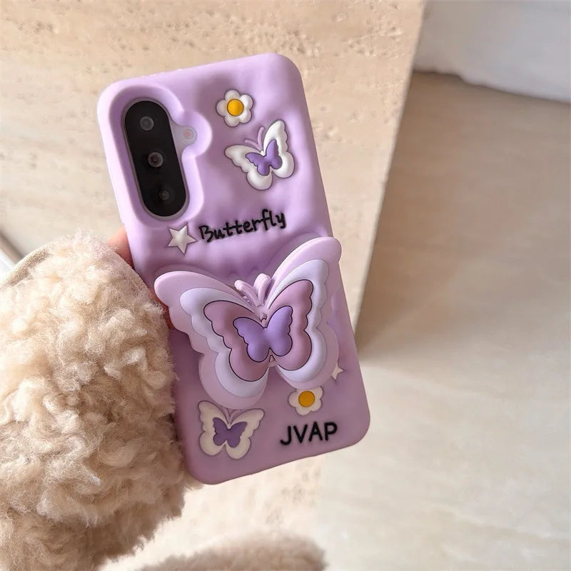 This image is showing Kawaii Butterfly Samsung Phone Case, one option is the purple design with a large 3D butterfly in the middle with smaller butterflies around it and some white flowers.