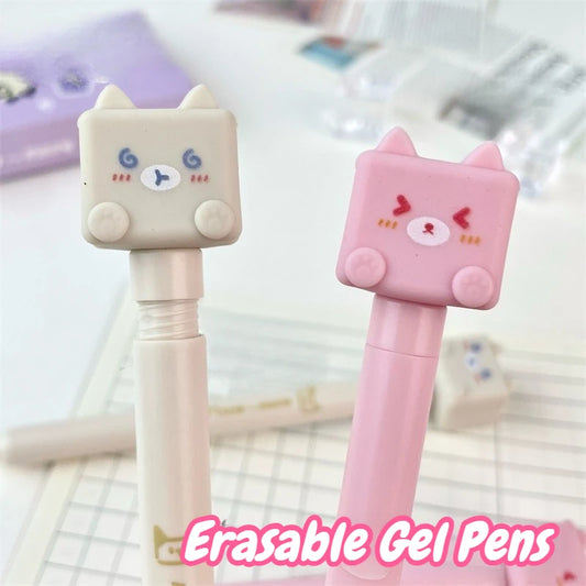 Kawaii Cat Erasable Gel Pens , pink and cream edition displayed on desk background filled with notes and papers.